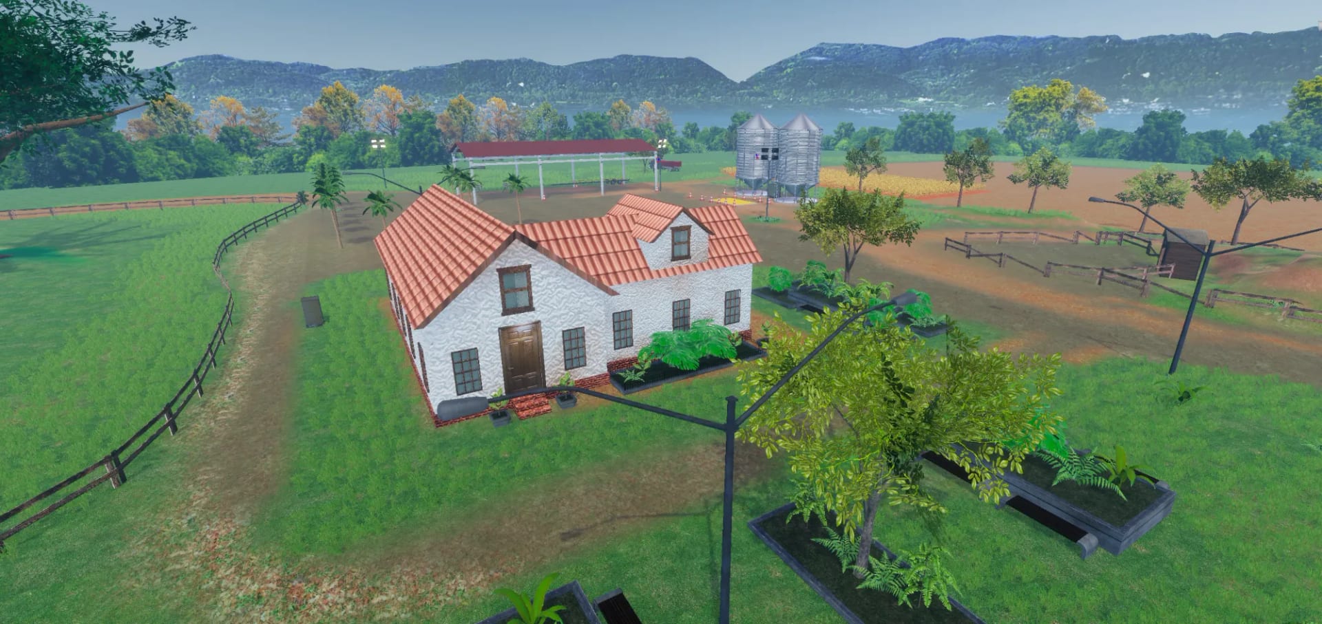 The farmstead from above, with the house, the open shed, the silos and the soybean field