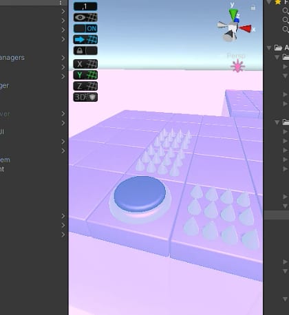 A blue button and spike tiles in the Unity editor