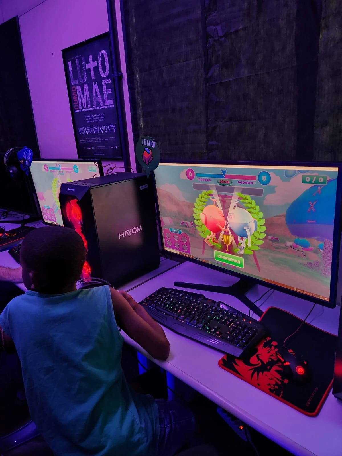 A child at the computer as a Super Hacka Kids match ends on the victory screen